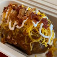 Loaded Baked Potato · 9 oz baked potato, sour cream, butter, cheddar cheese, bacon bits, and jalapeños.