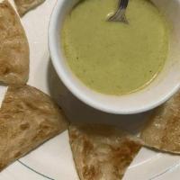 Roti with Green Curry / โรตีแกงเขียว · Pan fried Roti (Asian pita bread) served with green curry dipping sauce..
