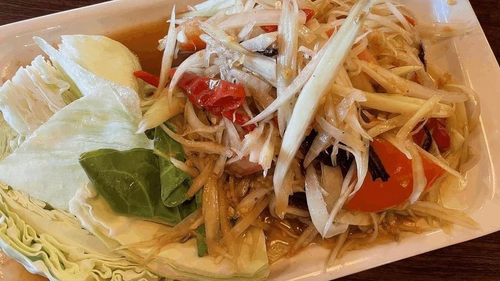 Laos Papaya Salad / ส้มตำมิตรภาพไทยลาว · Shredded green papaya with green beans, tomato in spicy fresh lime juice Salted Crab and Fermented Fish.