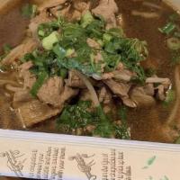 Beef Noodle Soup / ก๋วยเตี๋ยวเนื้อ · Rice noodles, sliced beef, green onion and bean sprouts in rich broth..