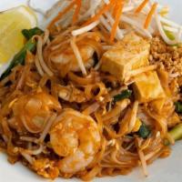 Pad Thai / ผัดไทย · Pan fried rice stick noodles with egg, fresh tofu, green onions, bean sprout and ground pean...
