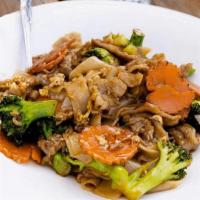Pad Se Ew / ผัดซีอิ้ว · Stir fried flat rice noodles with egg, carrots, and broccoli in black soy sauce..