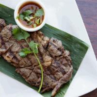  Isarn Beef Steak / เสือร้องไห้ · Grilled marinated beef with spicy dipping sauce : beef, pepper, soy sauce, and oyster sauce..