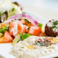 Vegetarian Platter · Two falafels, two dolmas, hummus, baba ghanouj, Mediterranean salad, served with pita bread.