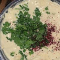 Hummus · Organic, garbanzo beans, lemon juice, fresh garlic, tahini sauce, topped with paprika, parsl...