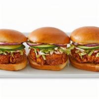 Sliders · Crispy chicken or marinated ribeye, coleslaw, cucumber, red onions, and spicy mayo, served o...
