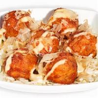 Takoyaki · Fried octopus dumplings drizzled with Japanese mayonnaise, katsu sauce, and sprinkled with b...