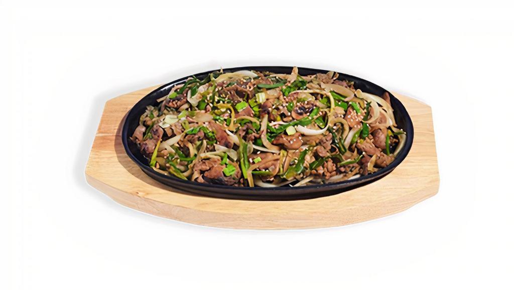 Bulgogi · Thinly sliced marinated ribeye, sautéed with mushrooms, scallions, sesame seeds, and onions. Served with white rice. 1940-2283 cal.