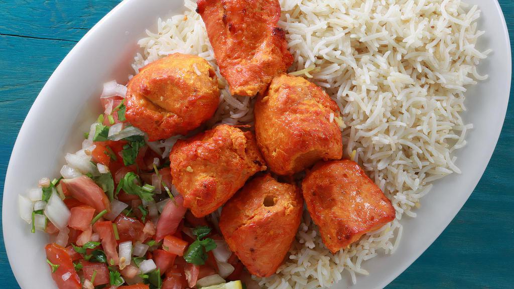 13. Chicken Tikka Kabab · Boneless chicken cubes cooked in charcoal tandoor.