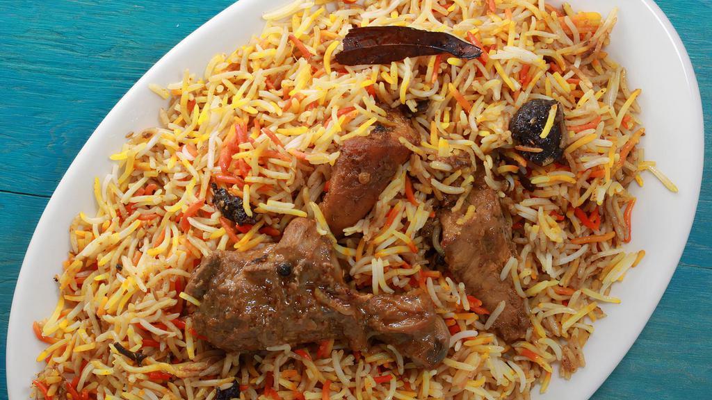 46. Chicken Biryani · Aromatic basmati rice with chicken pieces of cooked in authentic spices.