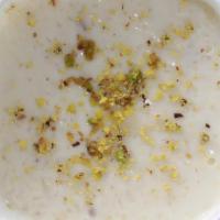 60. Homemade Kheer · Traditional peshawari rice pudding garnished with crushed pistachio.