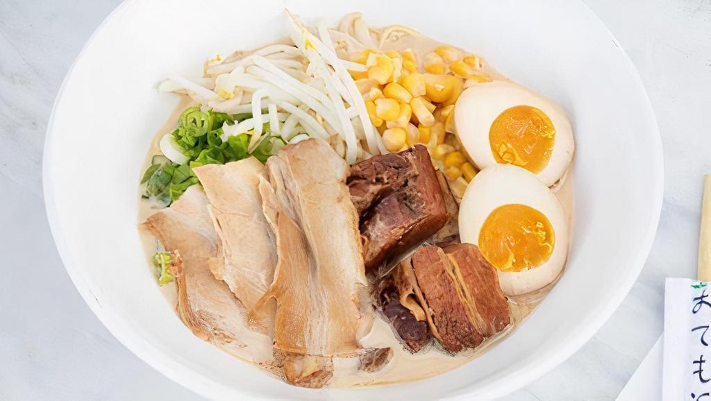Tonkotsu Ramen Deluxe · Rich pork broth and salt flavor. 3 pieces of chashu, 2 pieces of kakuni, green onion, bean sprout, boiled egg, and corn.
