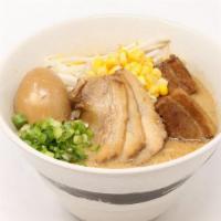 Tokushima Ramen Deluxe · Rich pork broth and sweet soy sauce flavor. 3 pieces of chashu, 2 pieces of kakuni, green on...