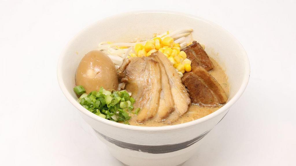 Tokushima Ramen Deluxe · Rich pork broth and sweet soy sauce flavor. 3 pieces of chashu, 2 pieces of kakuni, green onion, bean sprout, boiled egg, and corn.