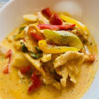 Yellow Curry  · Potato, carrot, onion, and tomato in yellow coconut curry.