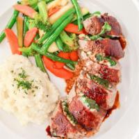 Steak Rolletini · Certified Angus NY Steak, stuffed with spinach and bleu cheese, balsamic sauce, garlic mashe...