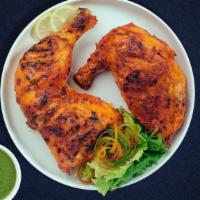 Chicken Tandoori Tandem  · Juicy chicken dipped in a yoghurt & ground spice marinated and baked in a tandoor clay oven.