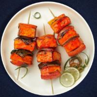 Paneer Tikka Tricker  · Fresh cubes of cottage cheese marinated in yoghurt and baked in a tandoor clay oven.