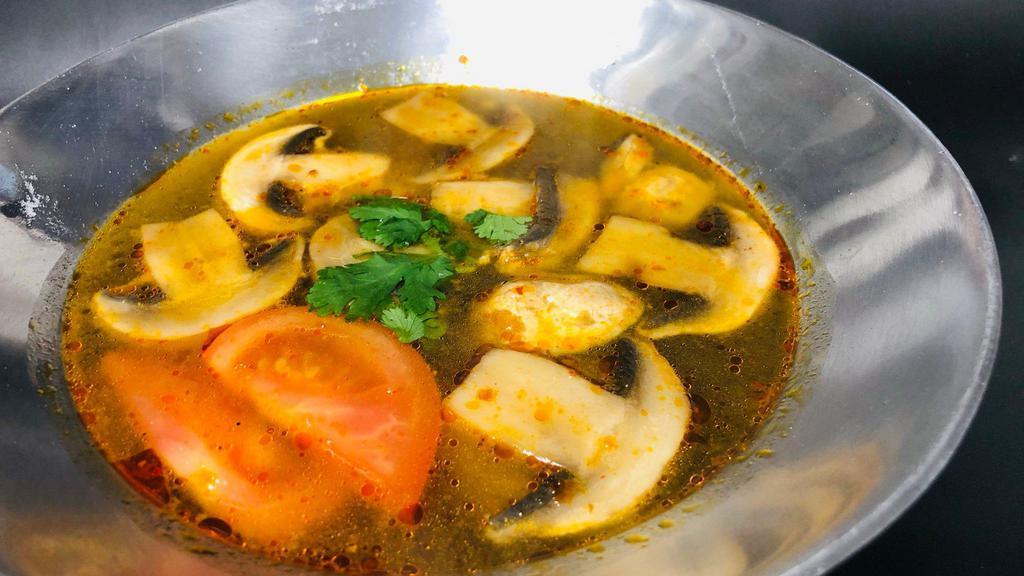 J14 Tom Yum Soup · Spicy and sour soup with lemongrass, galanga, tomato, and mushrooms.