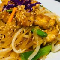 J46 Pad Thai · The famous fried rice noodles with tofu and veggie, bean curd, egg, bean sprouts, and ground...