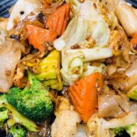 J47 Pad Se-Ew  · Fried flat rice noodles with tofu, soybean, broccoli, carrot, and egg.