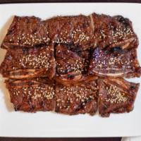 Short Rib Teriyaki · Grilled and marinated bone-in beef.