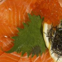 Salmon Don · Salmon over sushi rice with shredded nori and green onions.
