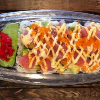 Hawaiian Roll · Imitation crab salad mix, avocado, cucumber, assorted fish tuna, salmon, sesame seeds, sushi...