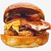 Bacon, Egg, Cheese & Potatoes Smashed Sammy · Breakfast sandwich with fried egg, bacon, and potatoes.