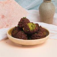 Falafel (6Pc) · Mix of golden fried fava and garbanzo beans with garlic, onions, herbs, and spices.