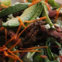 Black & Blue Steak Salad · Blackened beef tender steak, crisp greens, julienned carrots, cherry tomatoes, avocado, baco...