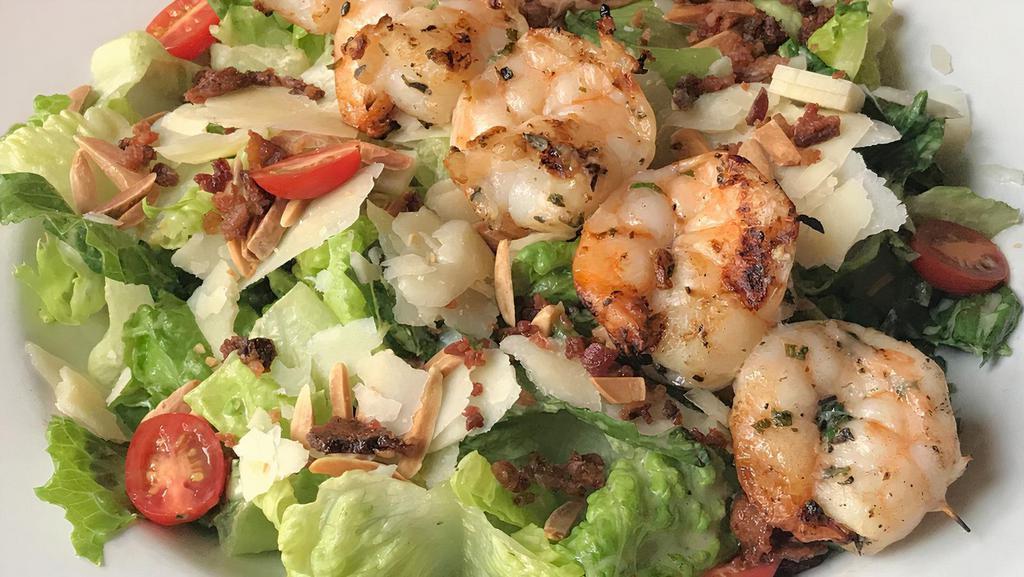 Miramonte Salad with Grilled Prawns · Grilled prawns, romaine lettuce, cherry tomatoes, toasted almonds, bacon crumble, swiss and asiago cheese, lemon vinaigrette.