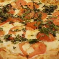 16. Margherita Special Pizza · Tomatoes, basil, mozzarella cheese and extra virgin olive oil.