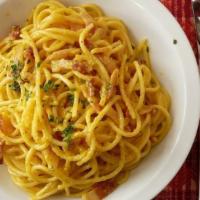 Spaghetti Carbonara · With diced ham and peas in sauce.