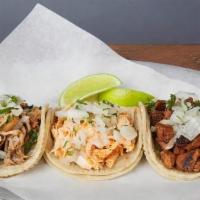 STREET STYLE TACOS :: · Authentic Mexican street tacos. On corn tortillas topped with your choice of meat, onion, an...