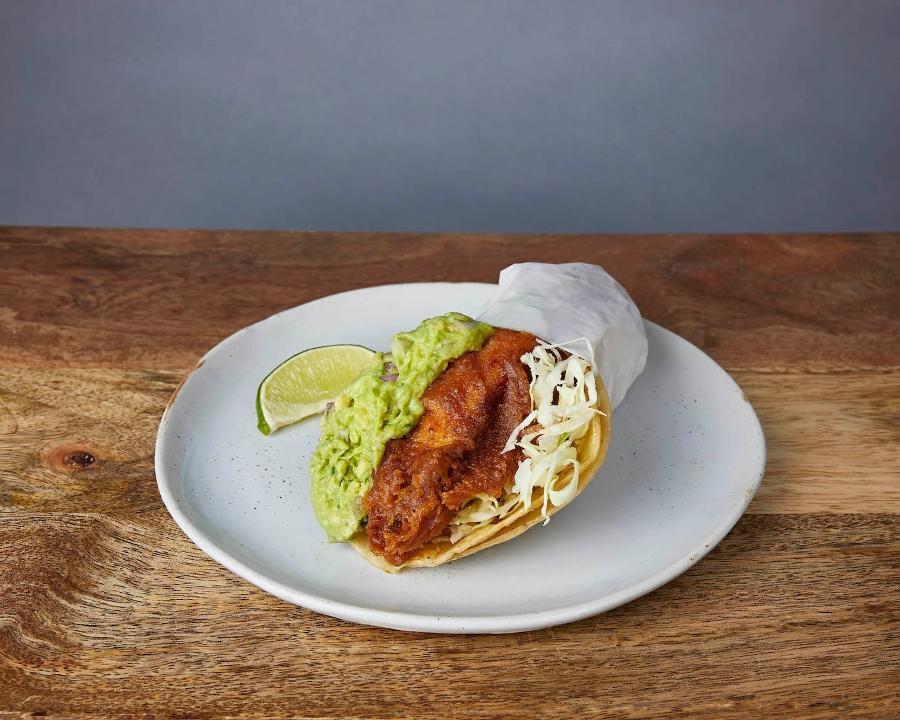 NICK'S WAY BAJA TACO :: · Beer-battered fish in a crispy tortilla wrapped in a soft tortilla. With Jack cheese, guacamole, cilantro, cabbage, red onions, salsa roja, & baja sauce (lime salsa)