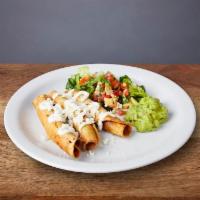 FLAUTAS :: · 3 crunchy rolled tacos topped with queso fresco and crema. Served with a side salad with gua...