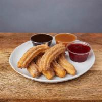 CHURROS :: · Classic Mexican churros with chocolate, caramel, or strawberry sauce