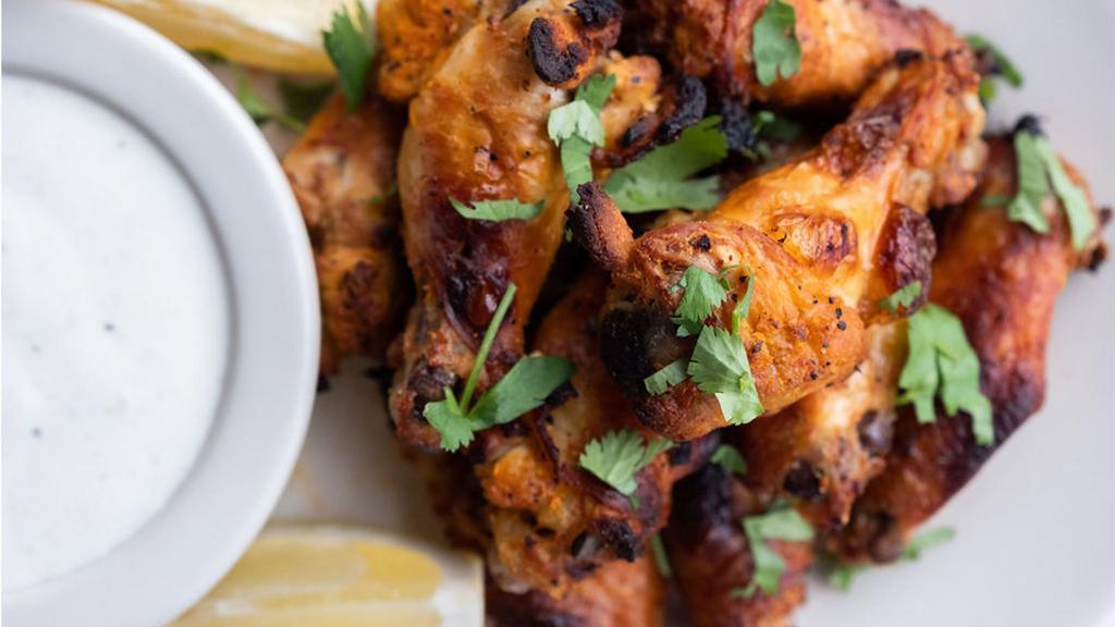 FLAME ROASTED CHICKEN WINGS · Our signature marinated wings taken to the next level (of heat!) specify mild, spicy or atomic (if you dare!) served with your choice of cool ranch, spicy buffalo ranch, or creamy blue cheese dipping sauce
