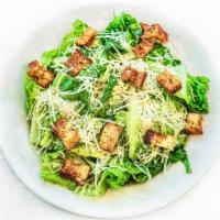 CHICKEN CAESAR SALAD · Crisp romaine, sliced chicken breast, housemade croutons, freshly grated Parmesan. Served wi...