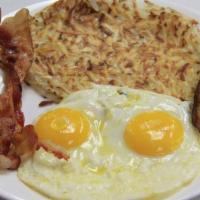 1. Basic Breakfast · Two eggs, two sausages, and ham or bacon served with hash browns and toast.