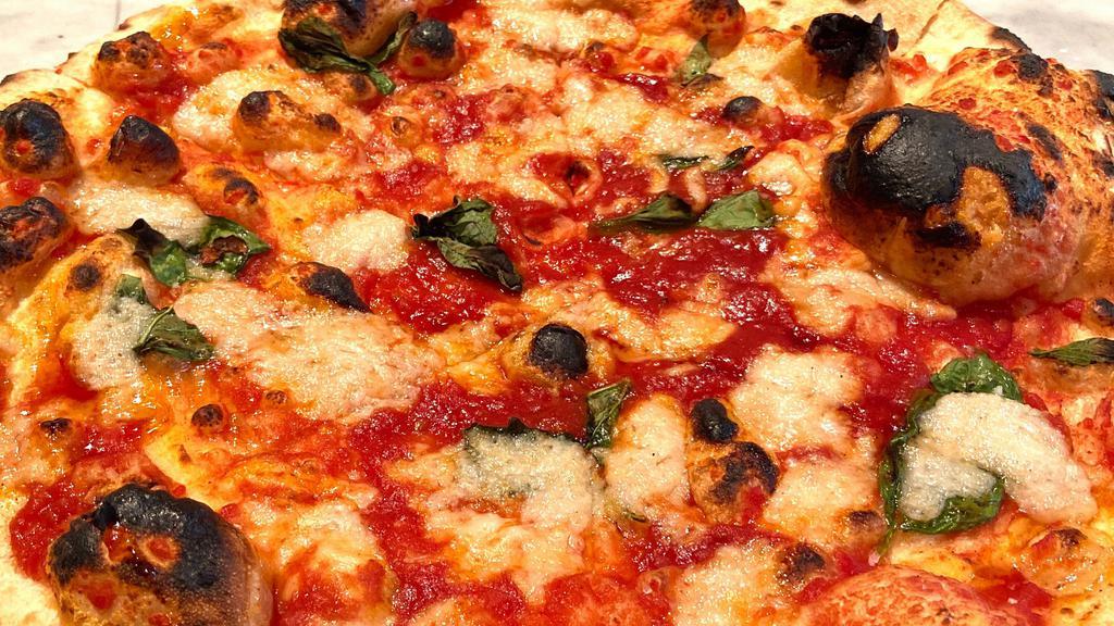Vegan Cheese Margherita Pizza · Tomato sauce, vegan mozzarella, basil, olive oil.
