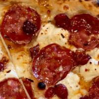 Cherry Soppressata Pizza · Cherries, smoked mozzarella, goat cheese, soppressata, calabrian chili honey drizzle