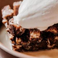 Mexican Chocolate Bread Pudding · Grand marnier sauce, fresh whipped cream.