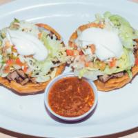 Sopes - Carne · Choice of meat with beans, pico de gallo, sour cream and cheese.