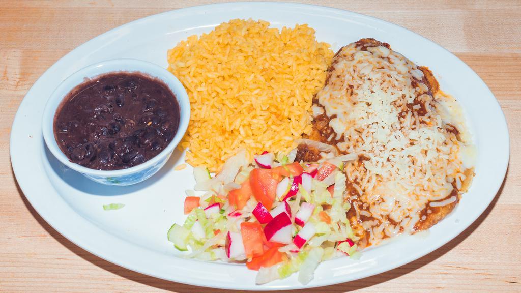 Plato Chiles Rellenos · One chile relleno served with rice beans, salad and hand made tortillas.