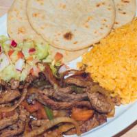 Fajitas · Fajitas (chix or beef) served with beans, rice and salad with hand made tortillas.
