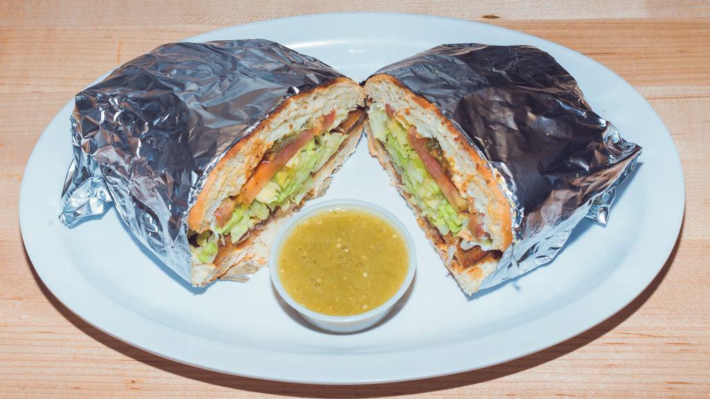 Torta · Lettuce, guac, queso fresco, tomatoes and choice of meat.