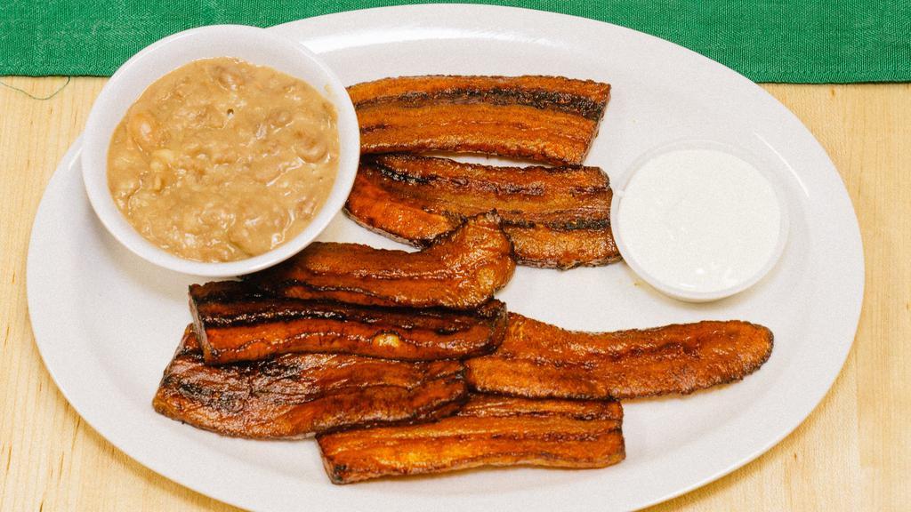 Platano Frito · Deep-fried plantain with beans and sour cream.