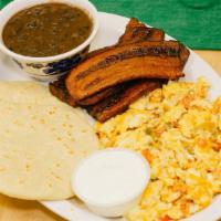 Desayuno Salvadoreno · Eggs (any style) served with beans, fried plantain and sour cream, with hand made tortillas.